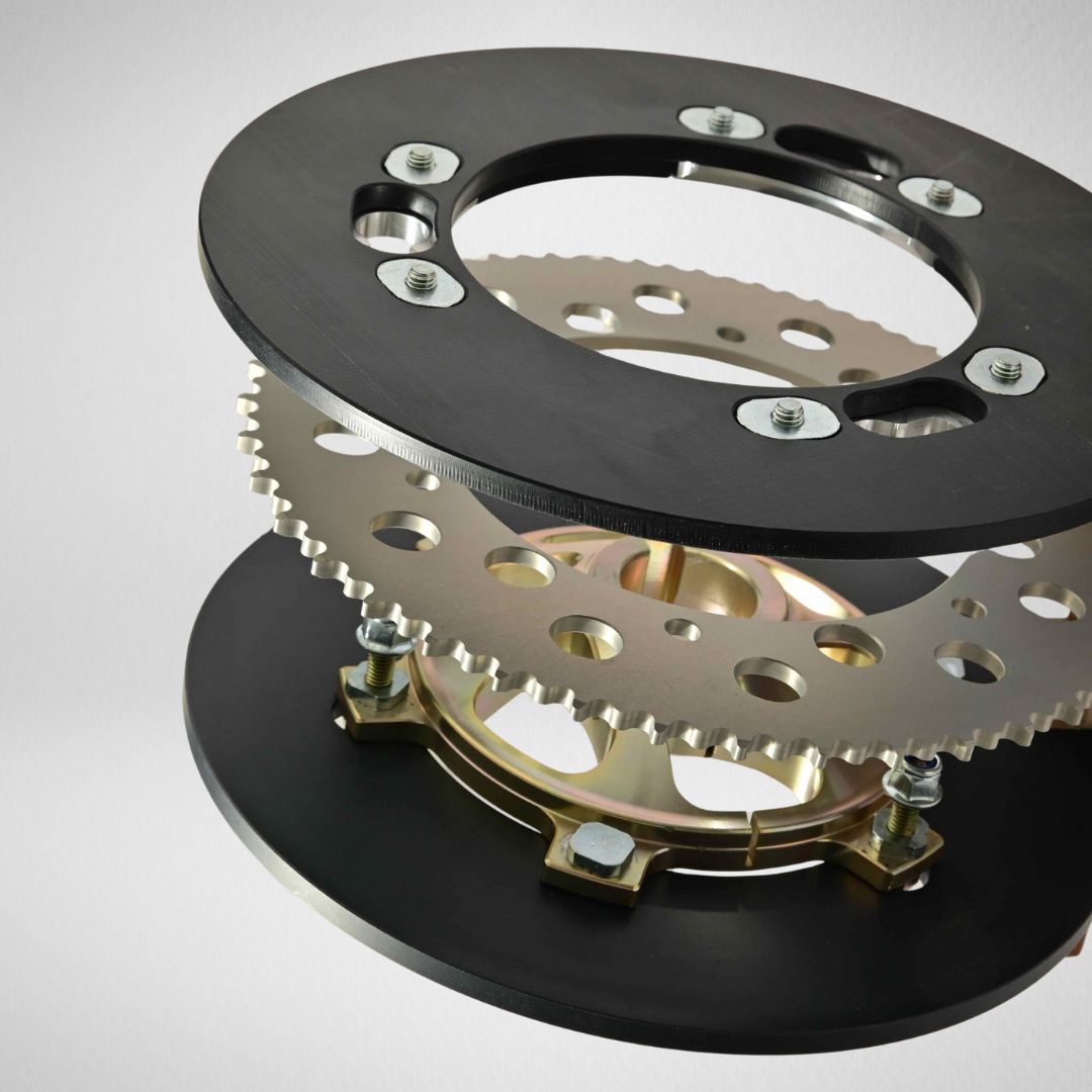 Angled view of go kart fast release kit on grey background